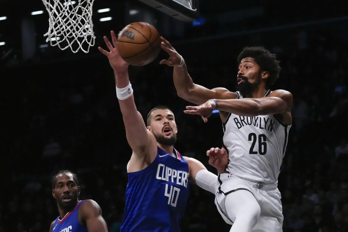 Brooklyn Nets' Spencer Dinwiddie (26) passes away from LA Clippers' Ivica Zubac (40) during the first half of an NBA basketball game in New York on Nov. 8, 2023. (Frank Franklin II/AP Photo)