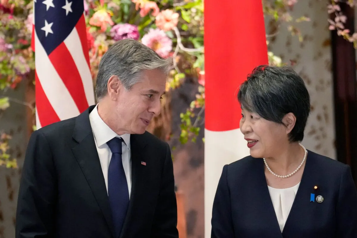 U.S. Secretary of State Antony Blinken (L) and Japanese Foreign Minister Yoko Kamikawa speak prior to a group photo session during their G7 foreign ministers' meetings in Tokyo on Nov. 8, 2023. (Eugene Hoshiko/POOL/AFP via Getty Images)