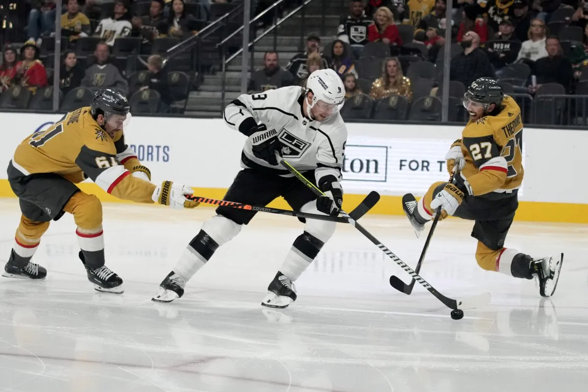 Vegas Golden Knights right wing Mark Stone (61) commits a hooking penalty on Los Angeles Kings center Adrian Kempe (9) during the third period of an NHL hockey game in Las Vegas on Nov. 8, 2023. (John Locher/AP Photo)