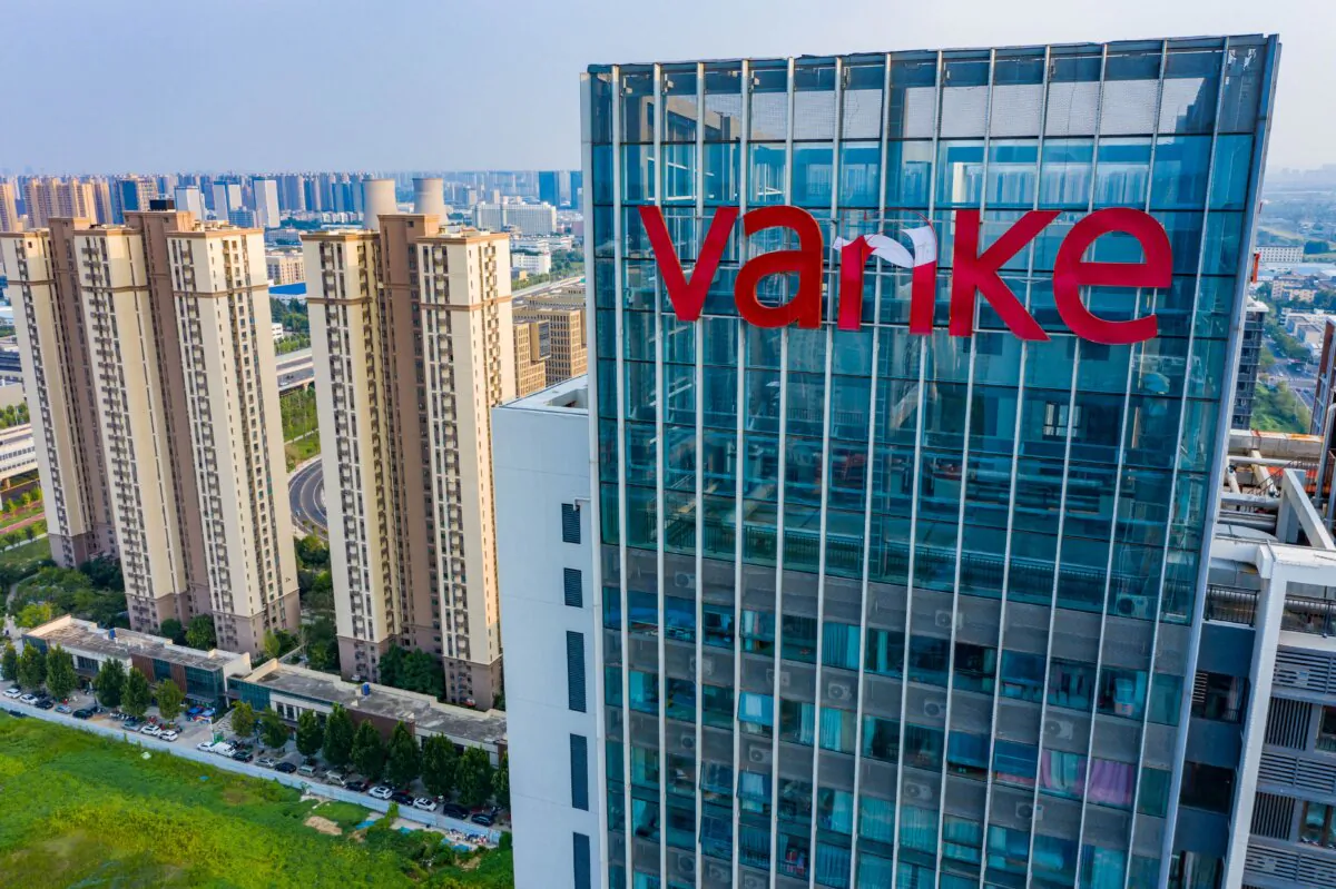 A damaged logo of Chinese real estate developer Vanke at a residential housing complex in Zhengzhou, Henan Province, China, on Aug. 30, 2023. (AFP via Getty Images)