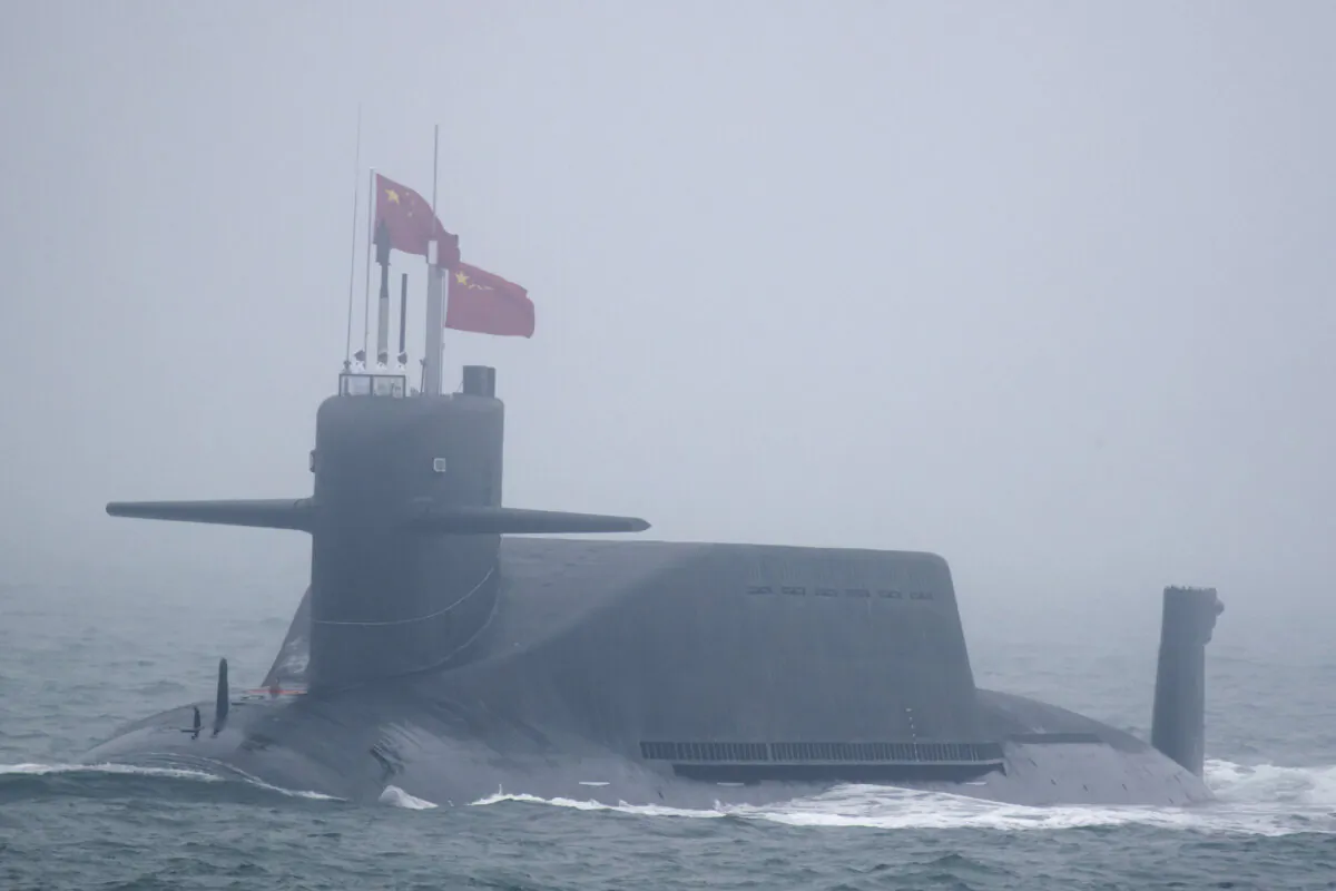 A new type 094A Jin-class nuclear submarine Long March 10 of the Chinese People's Liberation Army (PLA) Navy participates in a naval parade to commemorate the 70th anniversary of the founding of China's PLA Navy in the sea near Qingdao, in eastern China's Shandong Province, on April 23, 2019. (Mark Schiefelbein/Pool/AFP via Getty Images)