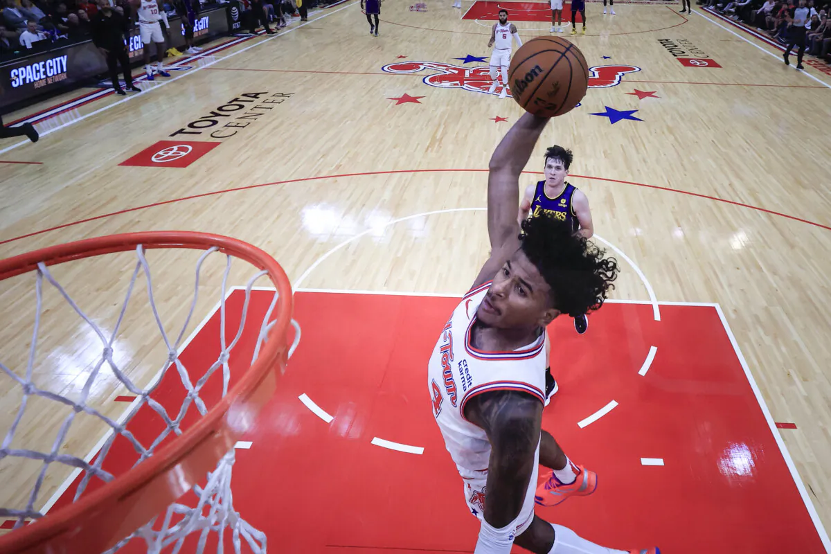 Jalen Green (4) of the Houston Rockets dunks the ball against the Los Angeles Lakers during the first half in Houston on Nov. 8, 2023. (Carmen Mandato/Getty Images)