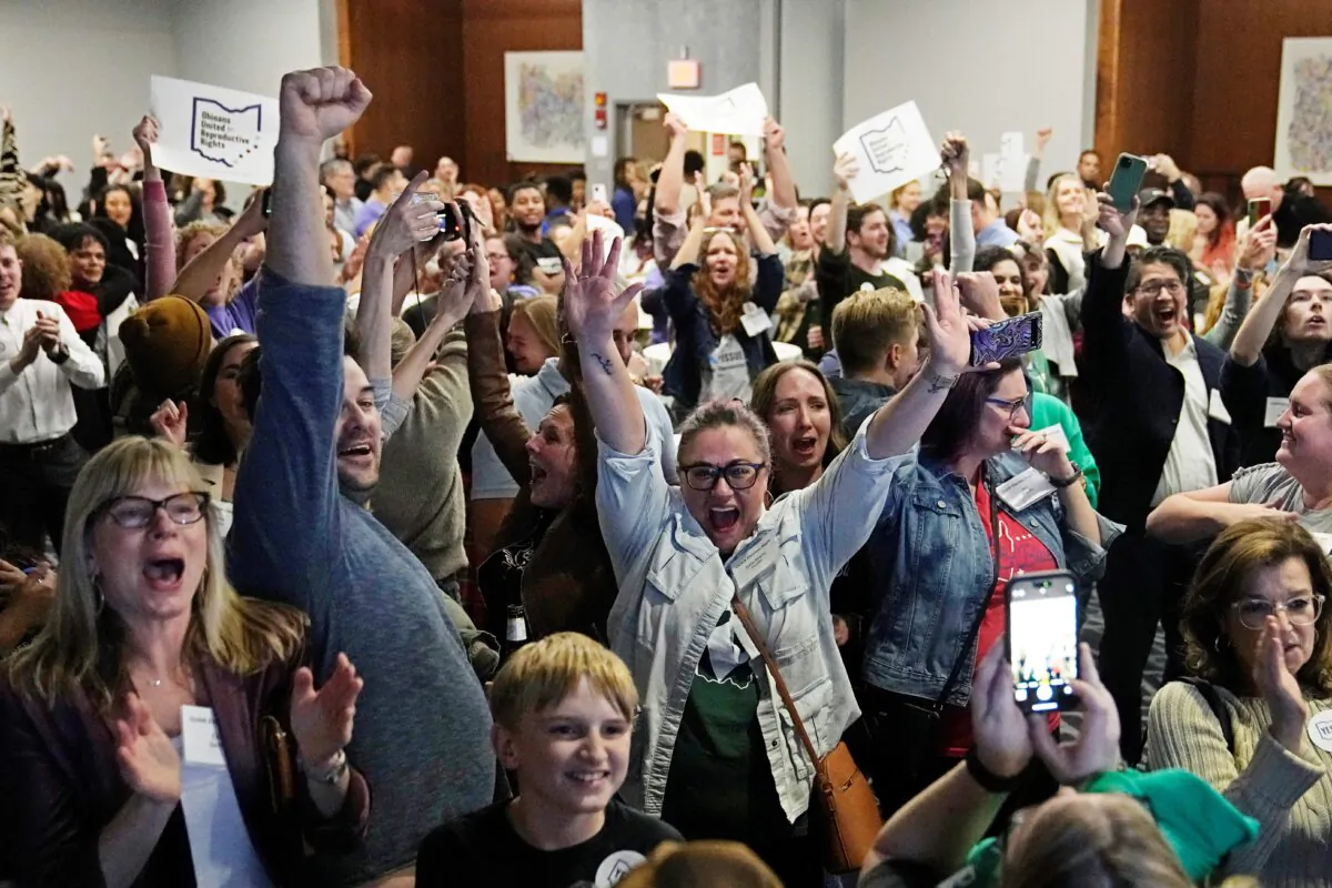 Issue 1 supporters cheer as they watch election results come in in Columbus Ohio., on Nov. 7, 2023. (Sue Ogrocki/AP Photo)