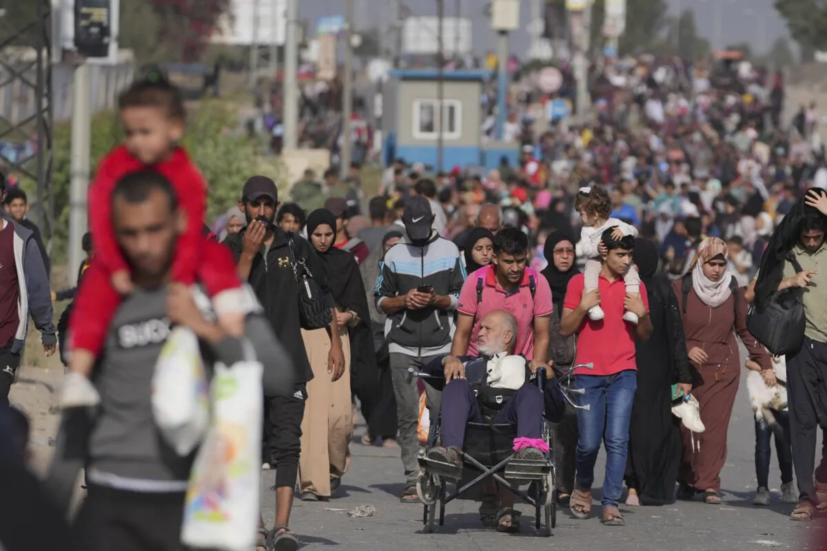 Palestinians flee to the southern Gaza Strip on Salah al-Din Street in Bureij, Gaza Strip, on Nov. 8, 2023. (Hatem Moussa/AP Photo)