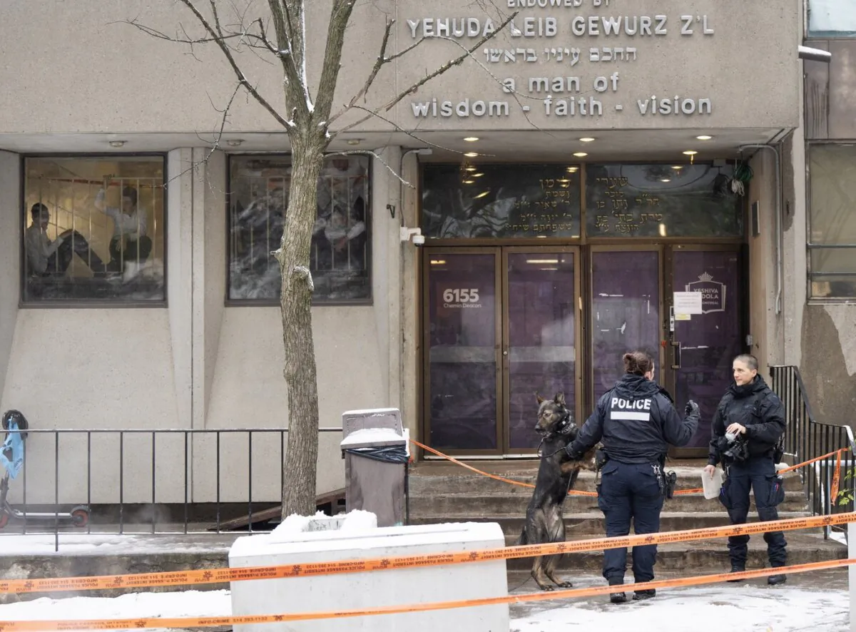 Police investigate the Yeshiva Gedolah school for clues after shots were fired at two Jewish schools in Montreal on Nov. 9, 2023. (The Canadian Press/Ryan Remiorz)