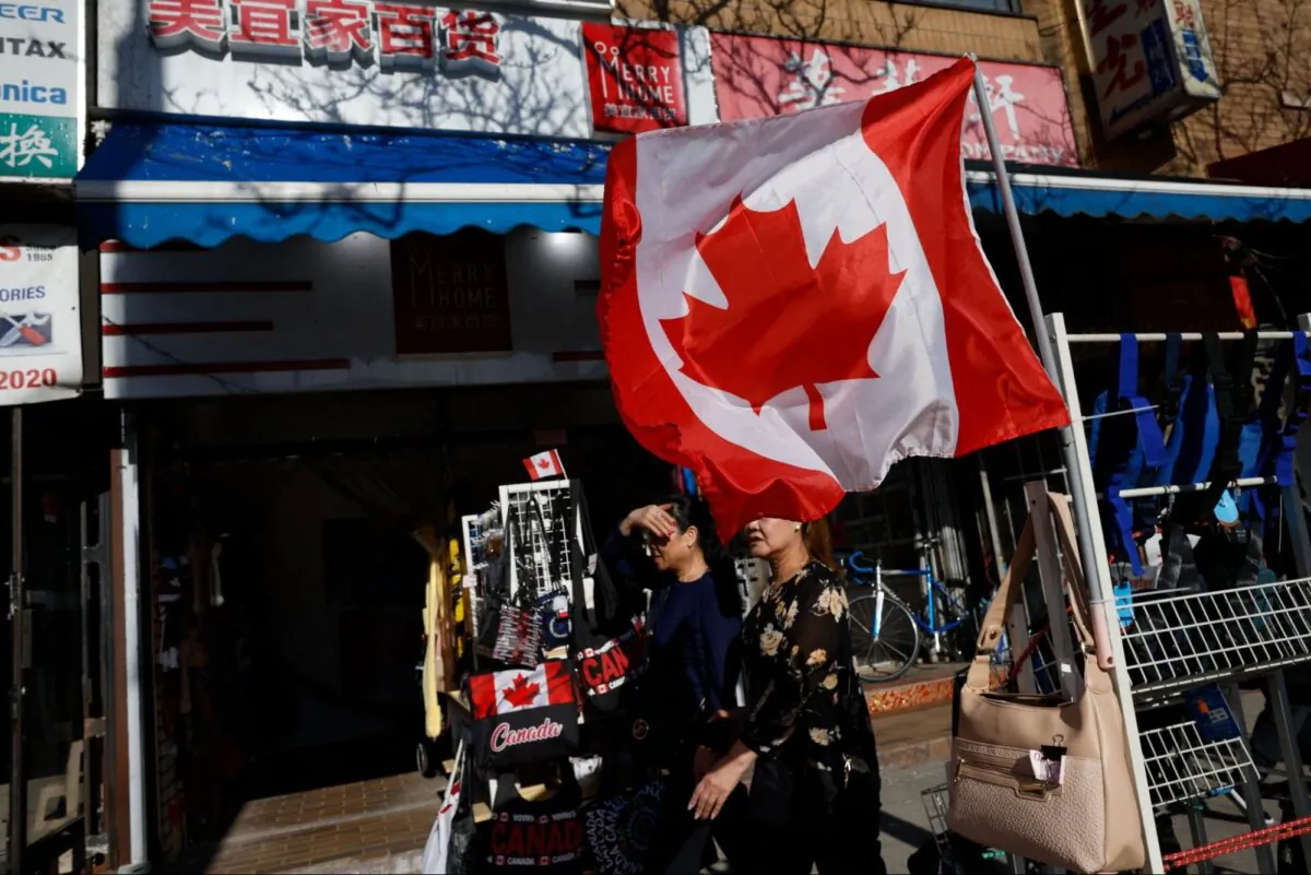 People walk through Chinatown in downtown Toronto, Ontario, Canada, on April 15, 2023. (COLE BURSTON / AFP)

