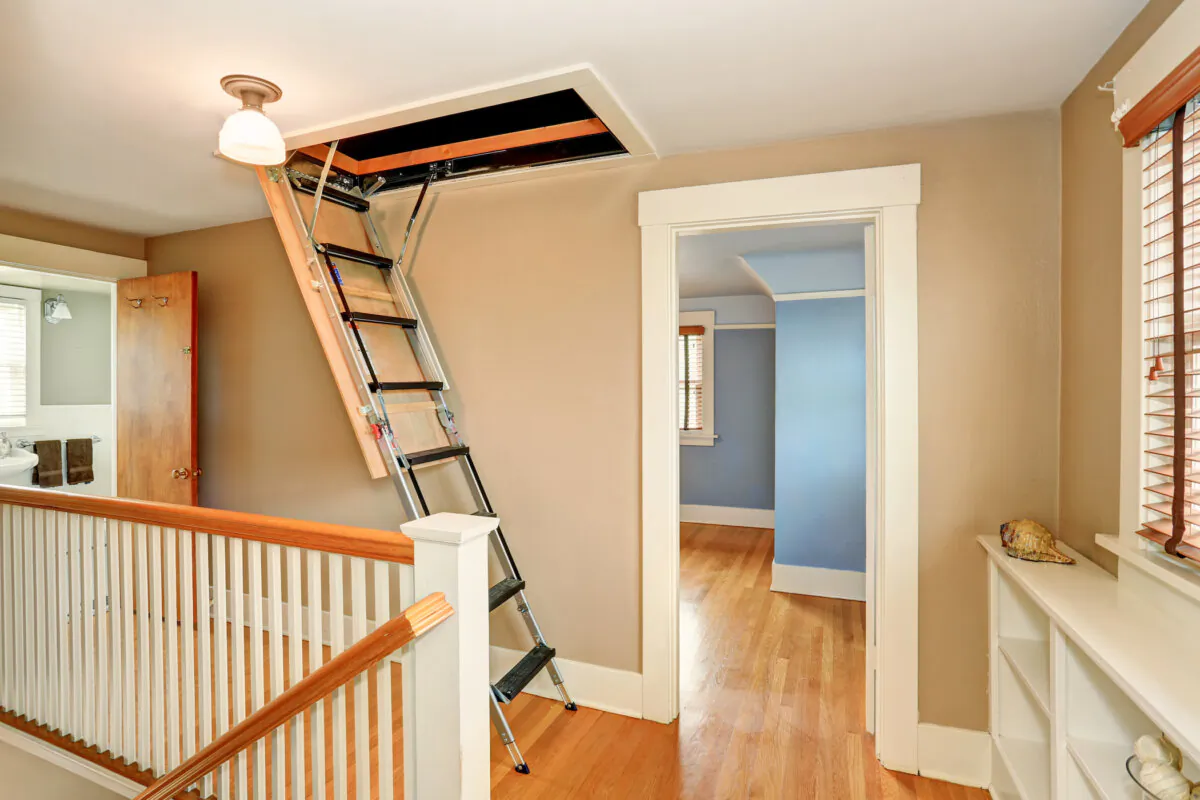Installing a folding ladder and fitting it properly can be a bit tricky, so read through the instructions twice before starting. (Artazum/Shutterstock)