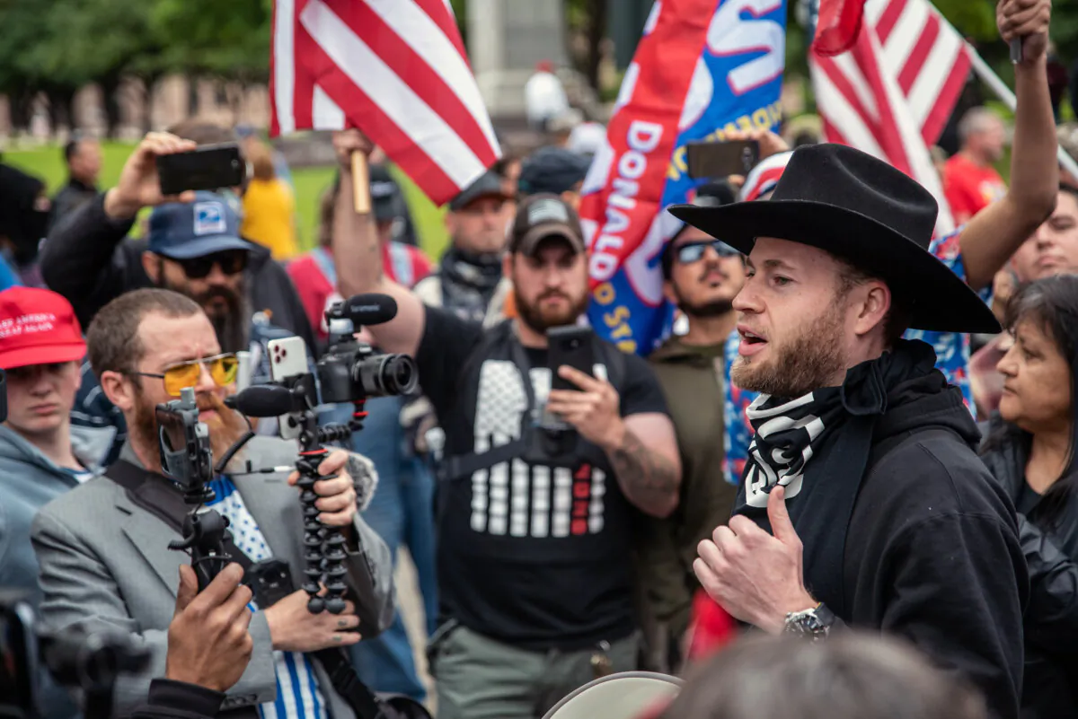 Infowars host Owen Shroyer (R) arrives at the Texas State Capitol building on April 18, 2020 in Austin, Texas. (Sergio Flores/Getty Images)