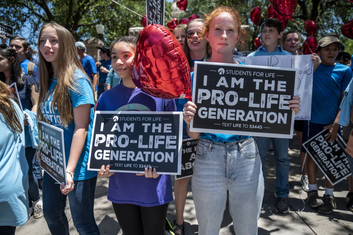 Pro-life protesters stand outside the Texas state capitol in Austin, Texas, on May 29, 2021. (Sergio Flores/Getty Images)