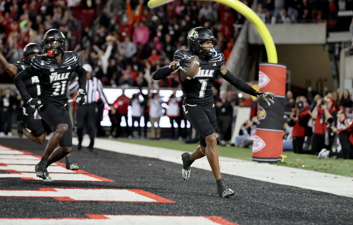Jimmy Calloway (7) of the Louisville Cardinals celebrates after scoring a touchdown on a blocked punt against the Virginia Cavaliers at Cardinal Stadium in Louisville, Ky., on Nov. 9, 2023. (Andy Lyons/Getty Images)