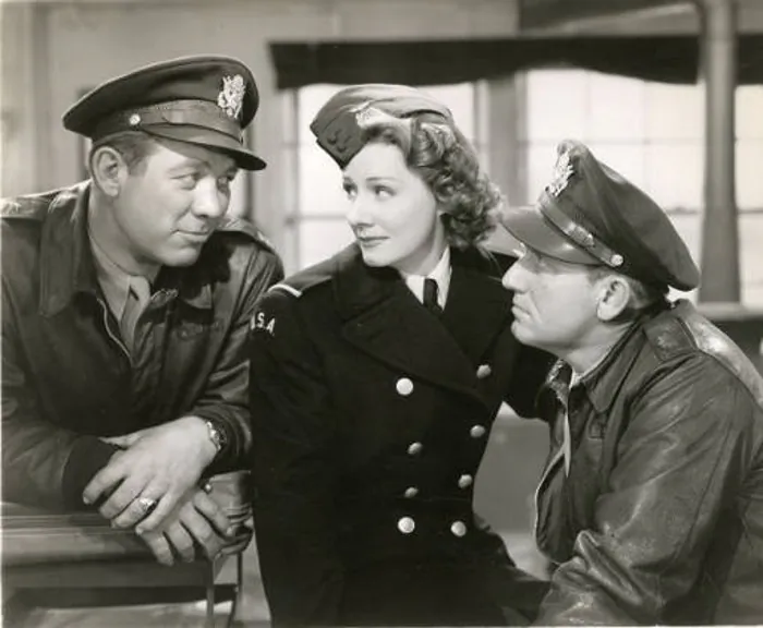 (L–R) Al Yackey (Ward Bond), Dorinda Durston (Irene Dunne), and Pete Sandidge (Spencer Tracy), in “A Guy Named Joe.” (Metro-Goldwyn-Mayer)