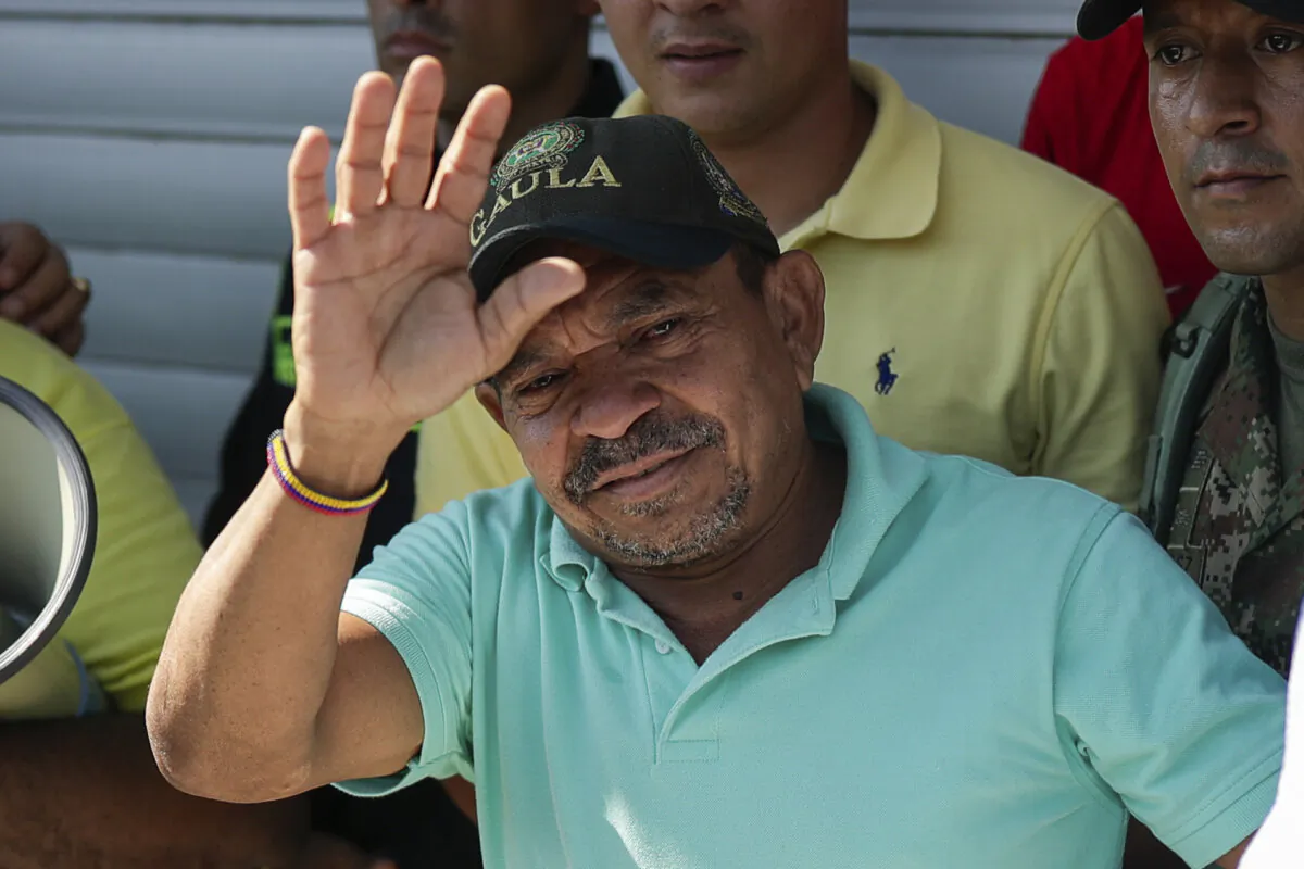 Luis Manuel Díaz waves to neighbors at his home in Barrancas, Colombia, on Nov. 9, 2023, after he was released by his kidnappers. (Ivan Valencia/AP Photo)