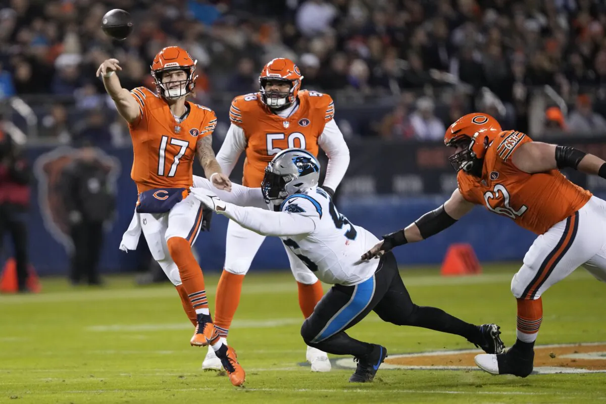 Chicago Bears quarterback Tyson Bagent (17) throws under pressure from Carolina Panthers center Bradley Bozeman during the first half of an NFL football game in Chicago on Nov. 9, 2023. (Charles Rex Arbogast/AP Photo)