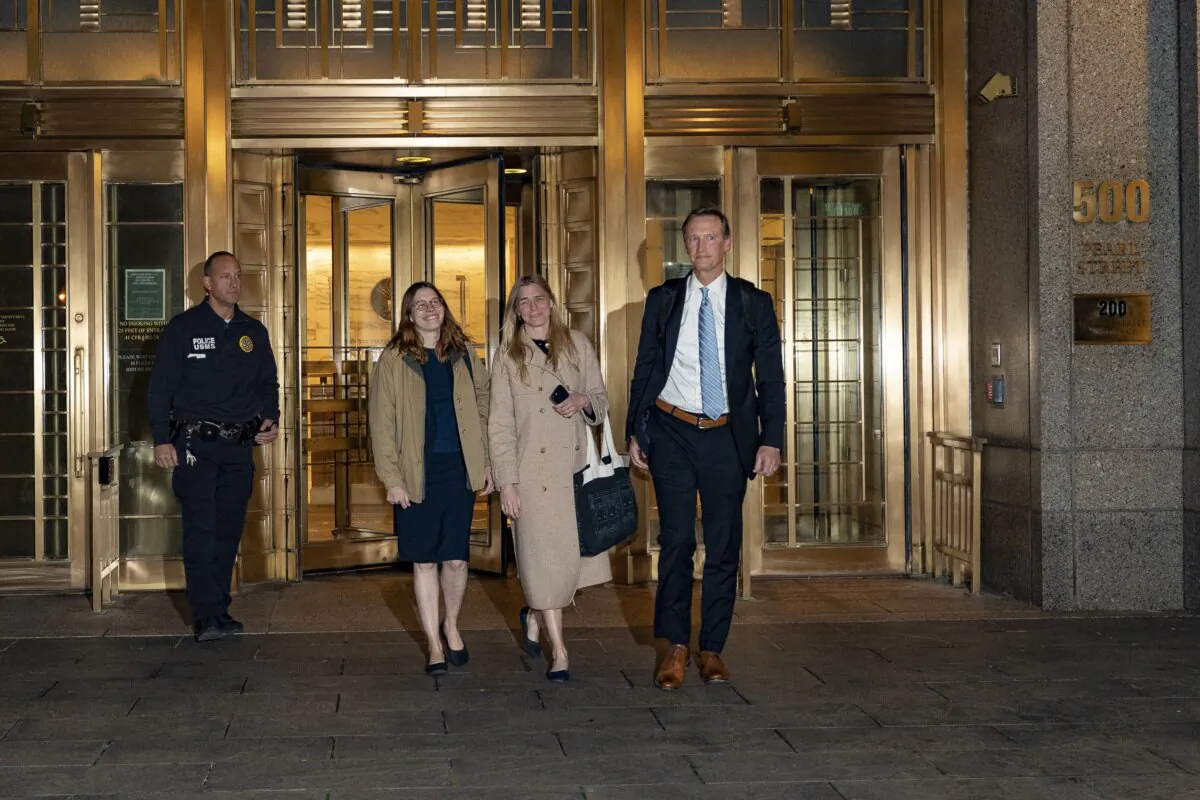 Graham Chase Robinson (C) and her attorneys Alexandra Hardin (center L) and Brent Hannafan (R) depart a federal courthouse in New York on Nov. 9, 2023. (Peter K. Afriyie/AP Photo)