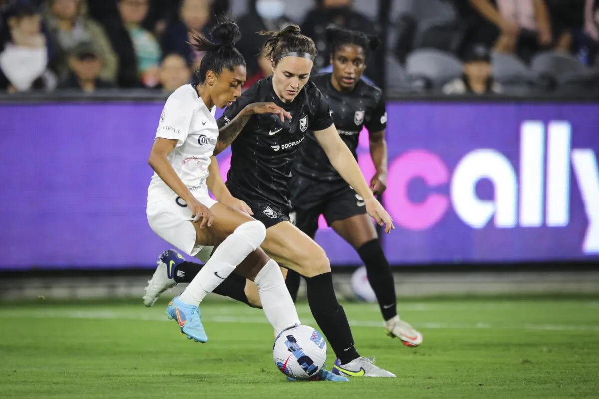 Kerolin Nicoli (9) of North Carolina Courage in possession of the ball against Megan Reid (2) of Angel City FC in Los Angeles on April 29, 2022. (Meg Oliphant/Getty Images)