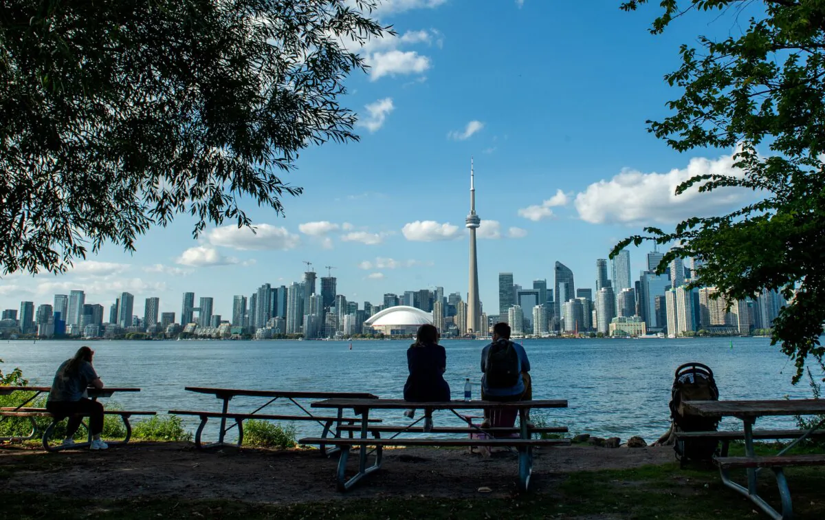 People enjoy the view of the Toronto skyline from the Toronto Islands on Lake Ontario, on Sept. 14, 2023. (Valerie Macon/AFP via Getty Images)