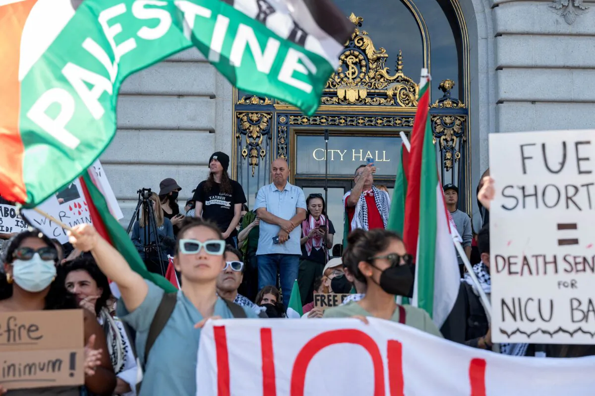 Protesters take part in a "Palestine Solidarity" march in front of City Hall in Oakland's neighboring city of San Francisco on Nov. 4, 2023. (Amy Osborne/AFP via Getty Images)