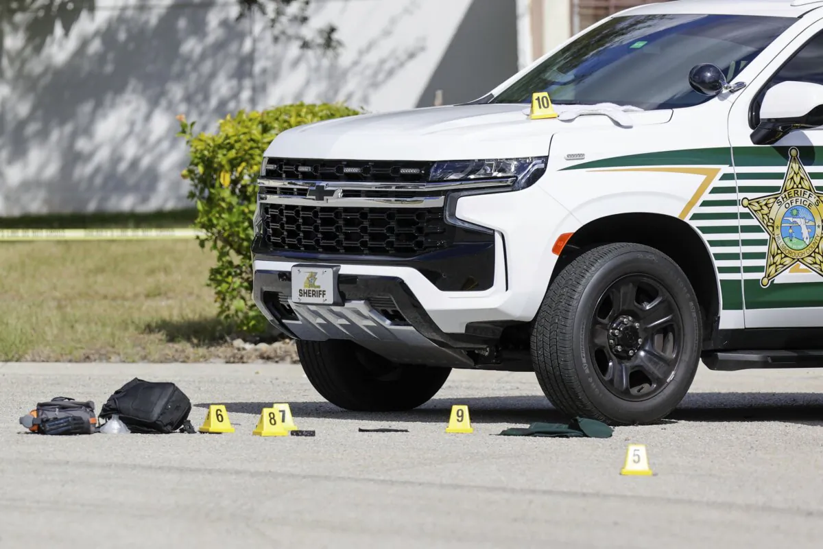 Hillsborough County Sheriff investigators on the scene of an incident where two of their own deputies were seriously injured after being struck by a vehicle while on a call for service, in Brandon, Fla., on Nov. 9, 2023. (Luis Santana/Tampa Bay Times via AP)