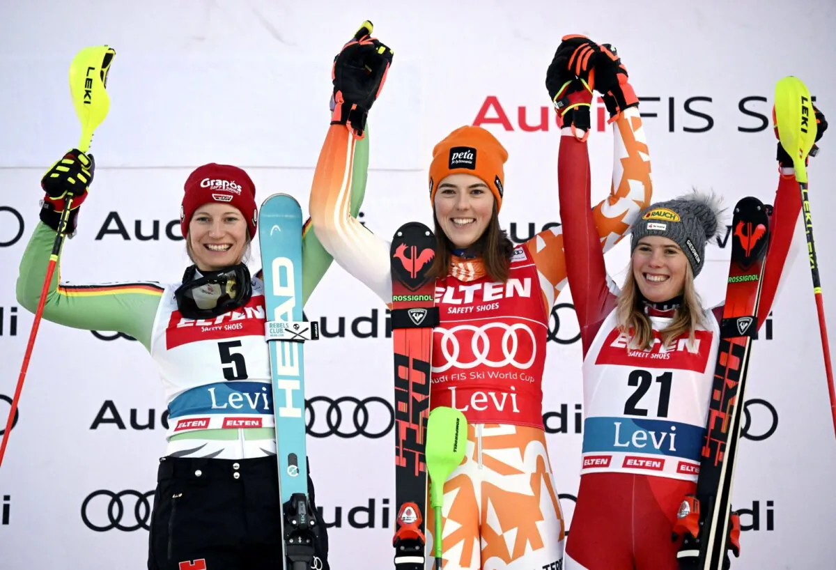 Slovakia's Petra Vlhova celebrates on the podium after winning the women's slalom alongside second place Germany's Lena Duerr and third place Austria's Katharina Liensberger during the Audi FIS Alpine Ski World Cup in Levi, Finland, on Nov. 11, 2023. (Vesa Moilanen/Lehtikuva via Reuters)