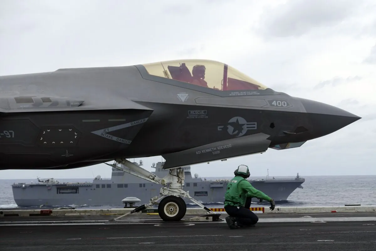 U.S. Navy’s F-35C stealth fighter jet and crew prepare ready for a takeoff for a flight demonstration during the Annualex 23 joint naval exercise, from aircraft carrier USS Carl Vinson off the Japanese coast, on Nov. 11, 2023. (Mari Yamaguchi/AP Photo)