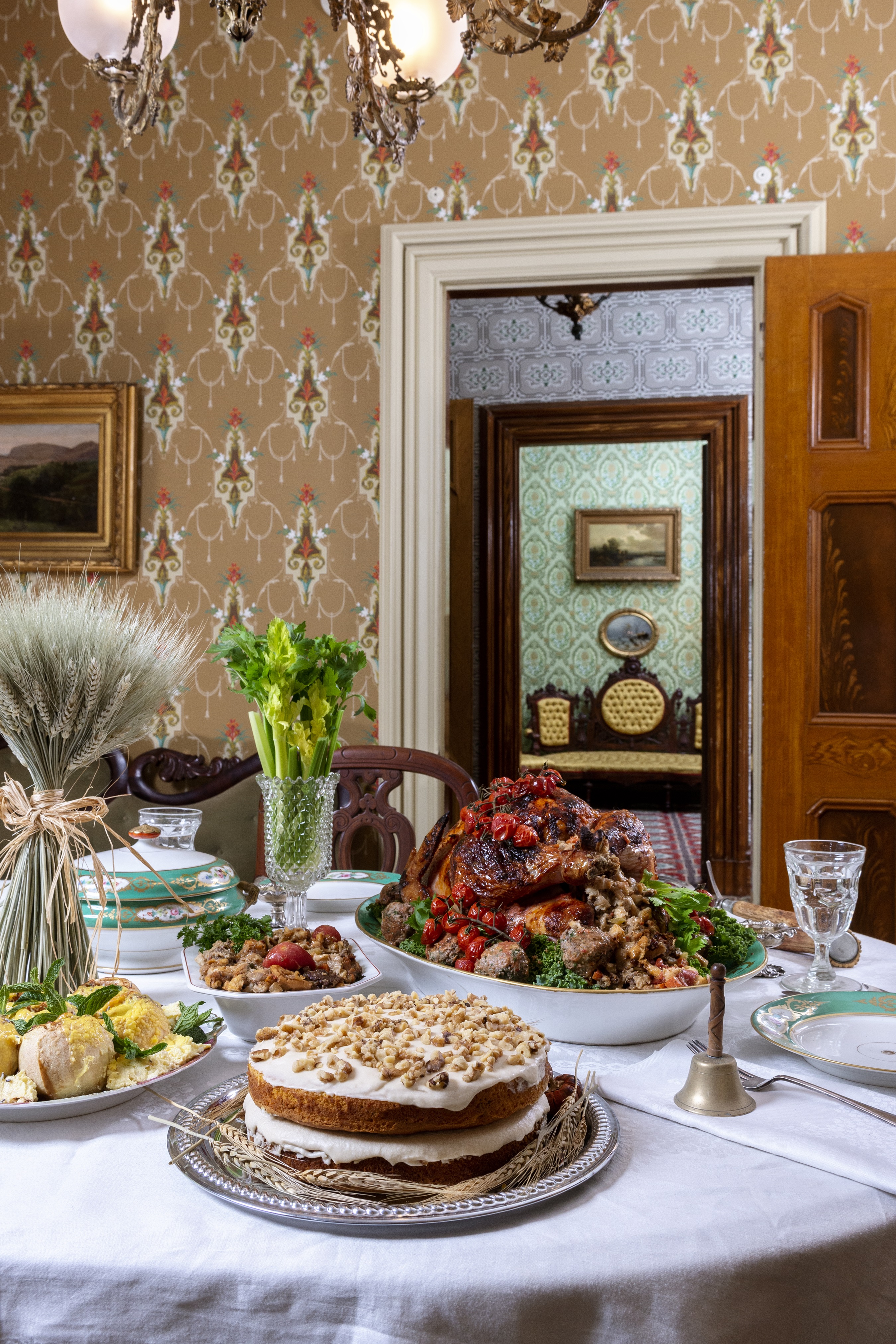 Thanksgiving was one of the most carefully planned meals of the year, and tables were lavishly set with fine crystal and seasonal decor. Note a peculiar display in the background: A cut glass vase of fresh celery, considered a status symbol due to the difficulty of growing it. (Photography by Heather Raub/FrontRoom Images; food styling by Dan Macey/Dantasticfood)