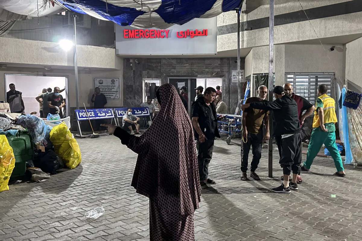 People stand outside the emergency ward of Al-Shifa Hospital in Gaza City, in the Gaza Strip, on Nov. 10, 2023. (KHADER AL ZANOUN/AFP via Getty Images)