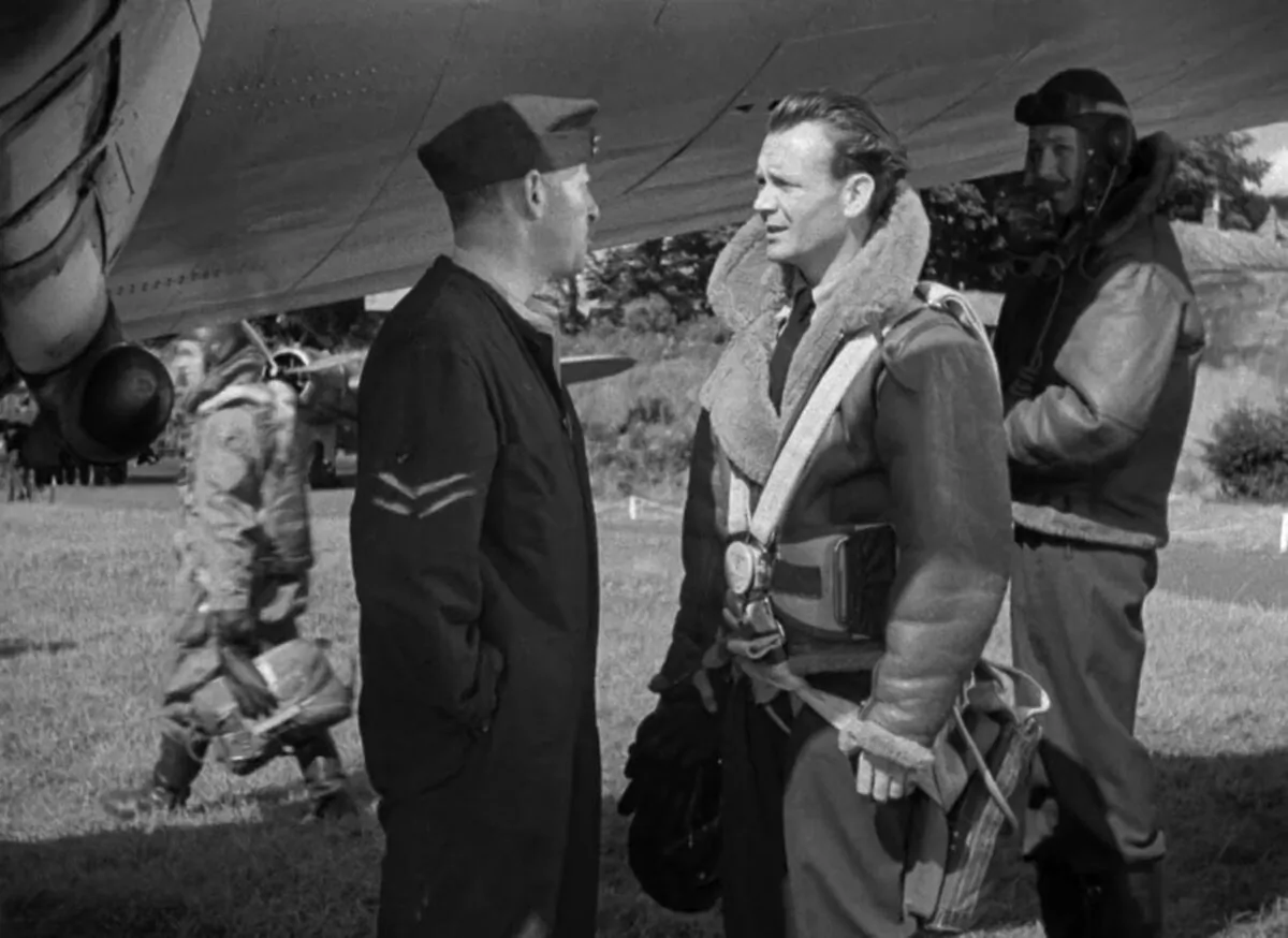 Pilot Peter Penrose (John Mills, R) begins to show signs of battle fatigue, in “Johnny in the Clouds” (Metro-Goldwyn-Mayer)