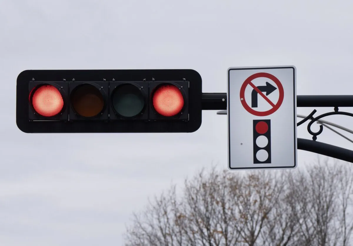 A sign prohibiting right turns at a red light is seen in Deux-Montagnes, Que., on Nov. 10, 2023. (The Canadian Press/Ryan Remiorz)