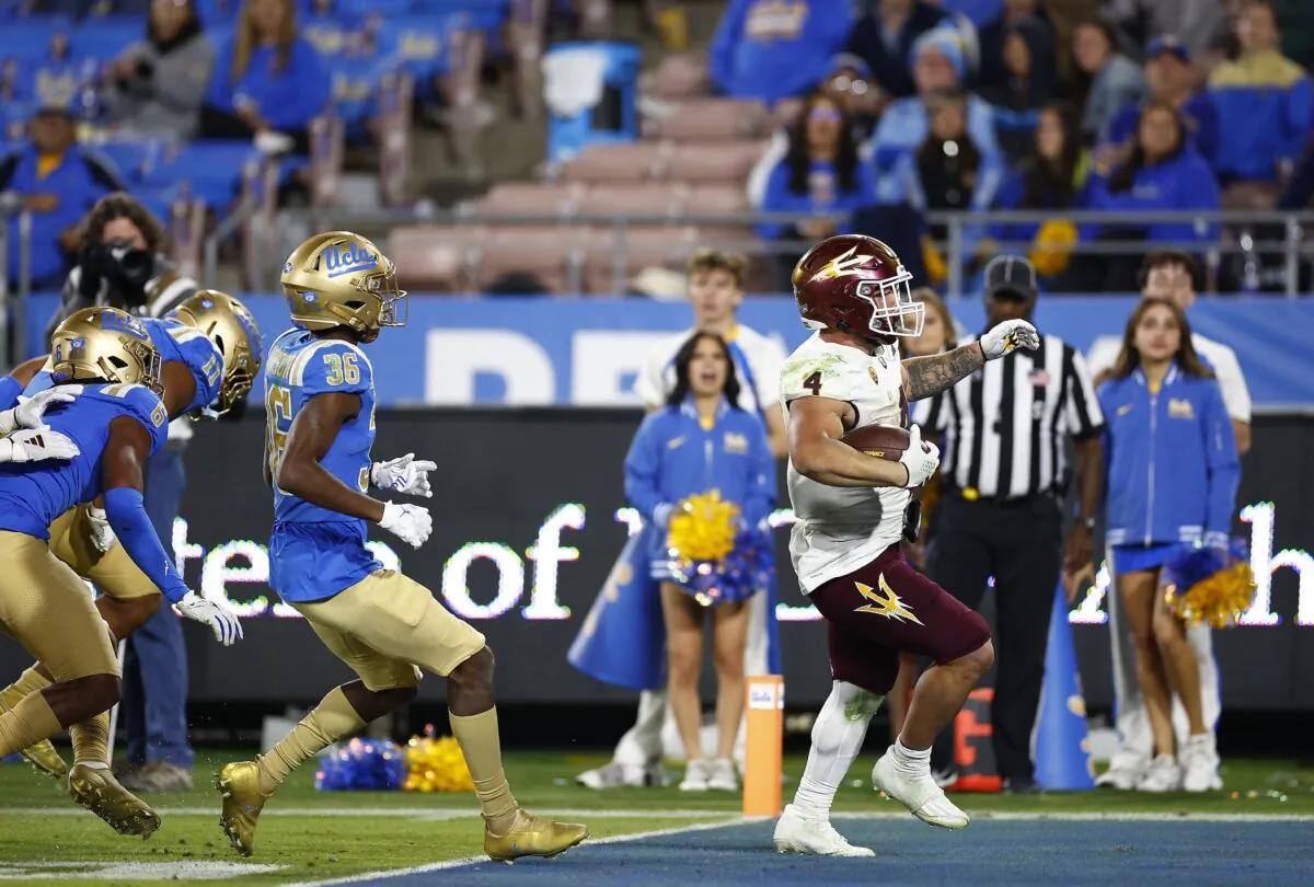 Cameron Skattebo (4) of the Arizona State Sun Devils runs for a touchdown against the UCLA Bruins in the second half at Rose Bowl Stadium in Pasadena, Calif., on Nov. 11, 2023. (Ronald Martinez/Getty Images)