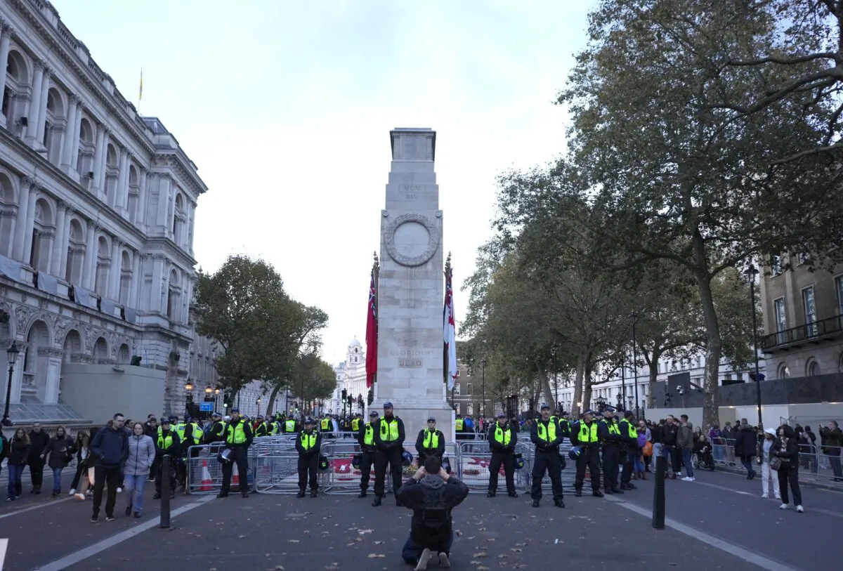 Officers from the Metropolitan Police on duty beside the Cenotaph in Whitehall, central London, during pro-Palestinian protest march which is taking place from Hyde Park to the U.S. embassy in Vauxhall, on Nov. 11, 2023. (Jeff Moore/PA)