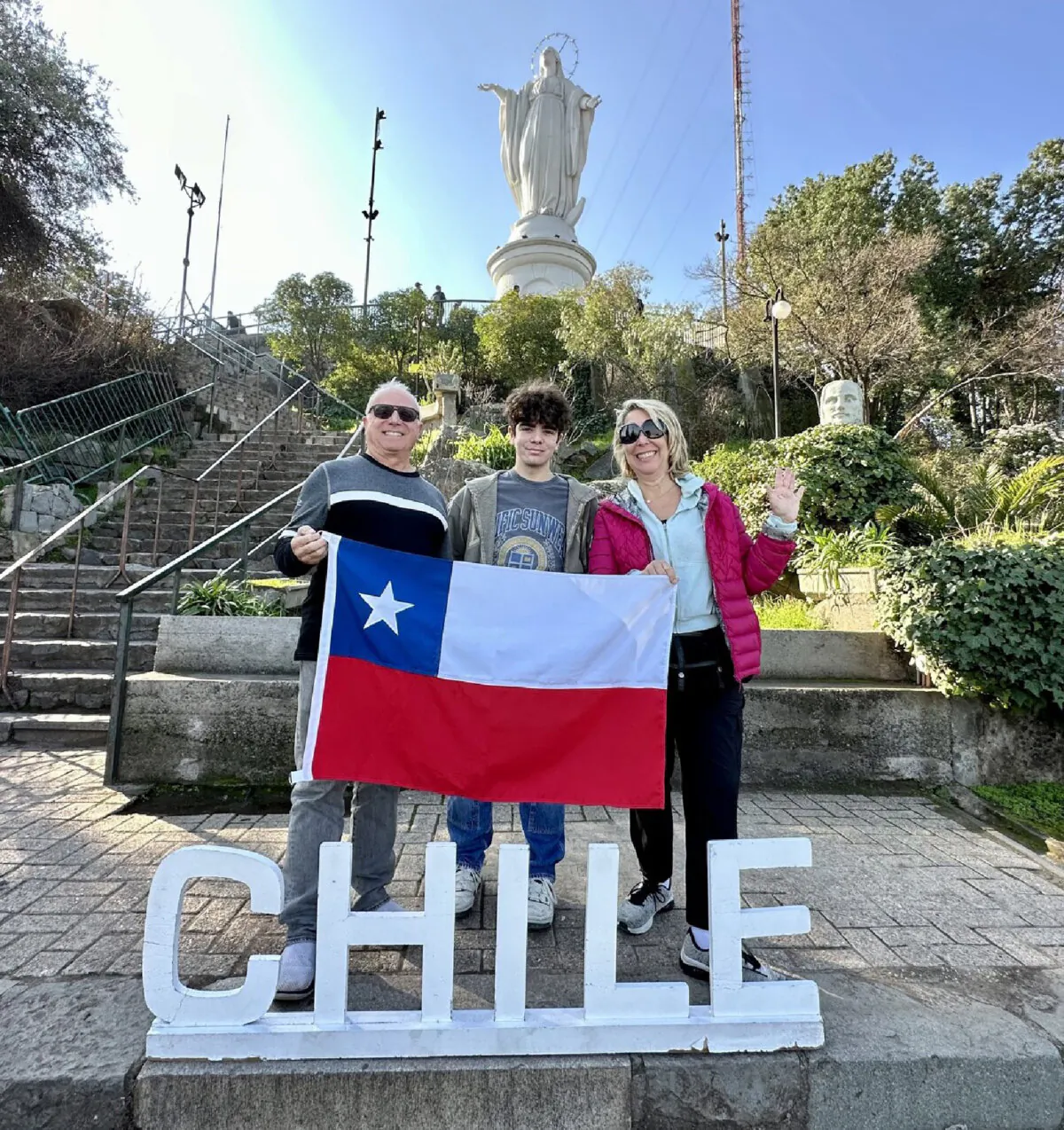The author and her family pose by the statue of the Virgin Mary on Cerro San Cristobal in Santiago, Chile. (Photo courtesy of Margot Black)