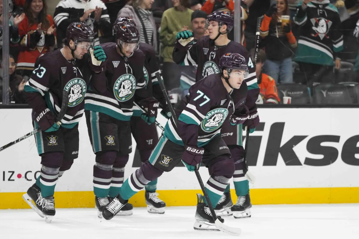 Anaheim Ducks' Frank Vatrano (77) skates toward the bench after celebrating his goal with teammates during the first period of an NHL hockey game against the San Jose Sharks in Anaheim, Calif., on Nov. 12, 2023. (Jae C. Hong/AP Photo)