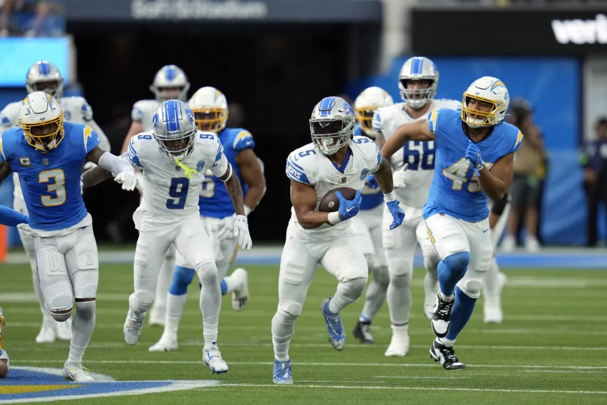 Detroit Lions running back David Montgomery (5) runs for a touchdown during the first half an NFL football game against the Los Angeles Chargers in Los Angeles on Nov. 12, 2023. (Ashley Landis/AP Photo)