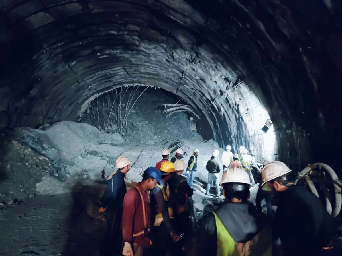 Rescuers inside a collapsed road tunnel where more than 30 workers were trapped by a landslide in northern in Uttarakhand state, India, on Nov. 12, 2023. (Uttarakhand State Disaster Response Force (SDRF) via AP)