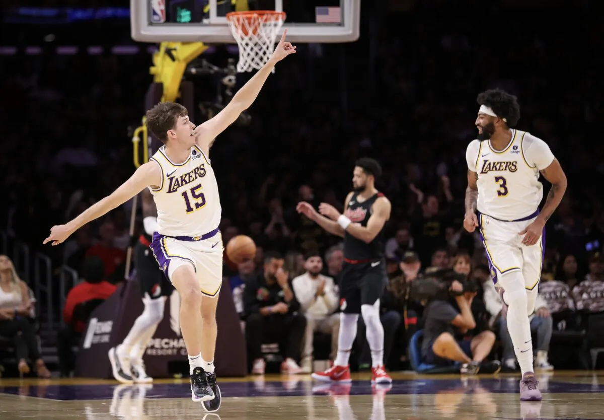 Austin Reaves (15) and Anthony  Davis (3) of the Los Angeles Lakers reacts in the first half against the Portland Trail Blazers in Los Angeles on Nov. 12, 2023. (Meg Oliphant/Getty Images)