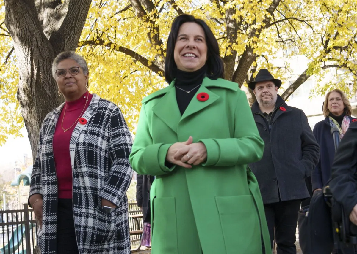 Montreal Mayor Valérie Plante arrives at a news conference flanked by Dominique Ollivier (L) in Montreal on Nov. 8, 2021. (The Canadian Press/Paul Chiasson)