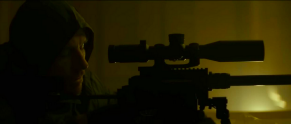 man with rifle in THE KILLER