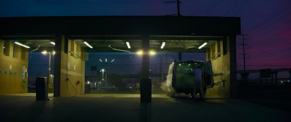 van at a carwash in THE KILLER