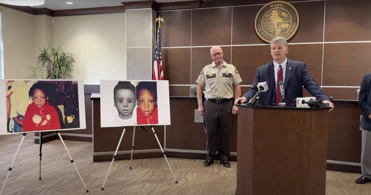 Georgia Bureau of Investigation Agent Jason Seacrist, at podium, and Ware County Sheriff Carl James address reporters in Waycross, Ga., on Nov. 13, 2023, in a still from video. (Georgia Bureau of Investigation via AP)