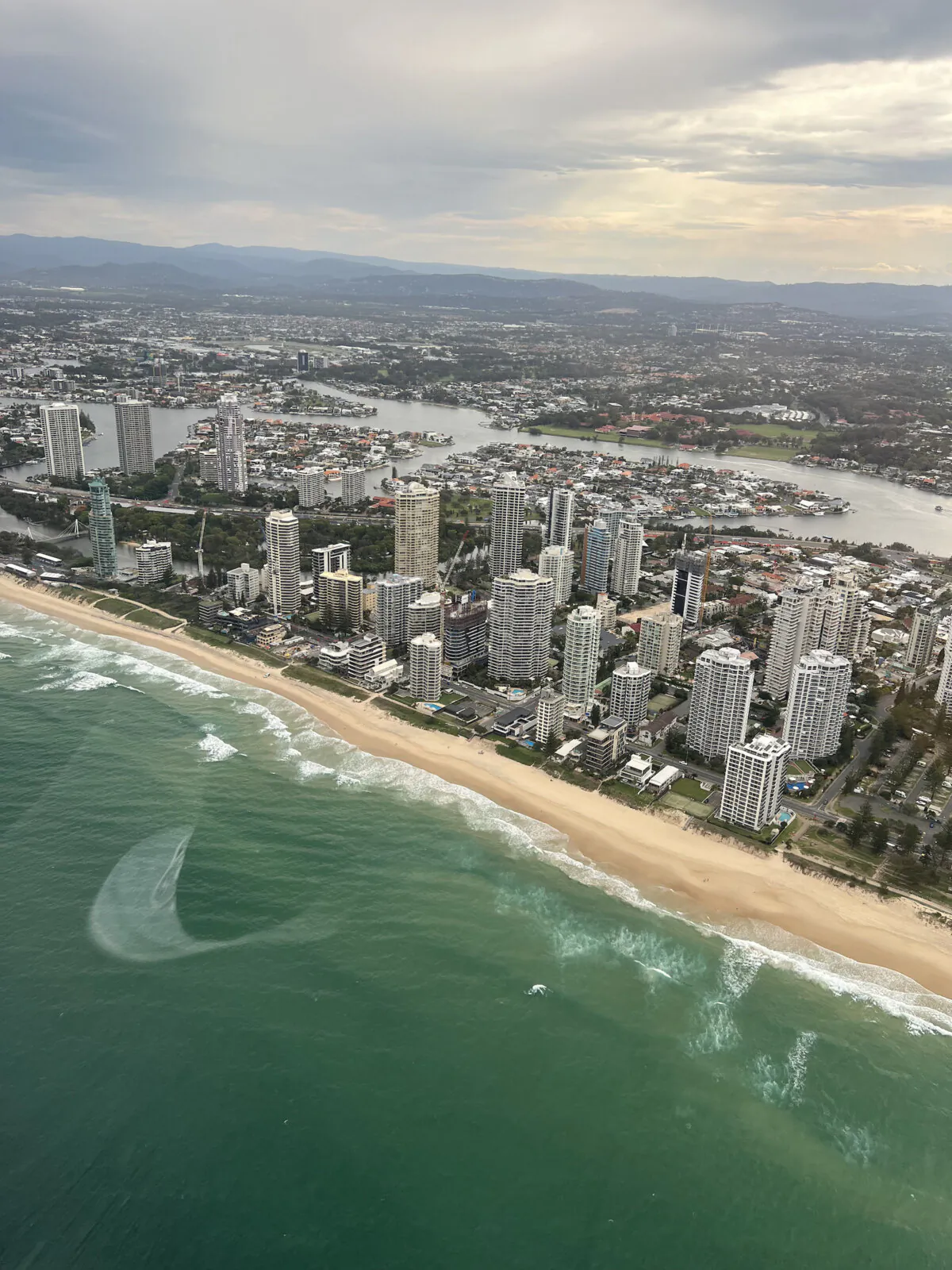 A bird's-eye view of Surfers Paradise and the Gold Coast and its myriad skyscraper hotels and condominiums. The Gold Coast extends for some 40 miles along southeastern corner of Queensland and contains dozens of suburbs, including Surfers Paradise. (Mary Ann Anderson/TNS)