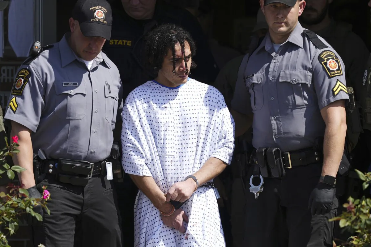 Law enforcement officers escort Danilo Cavalcante from a Pennsylvania State Police barracks in Avondale Pa., on Sept. 13, 2023. (Matt Rourke/AP Photo)