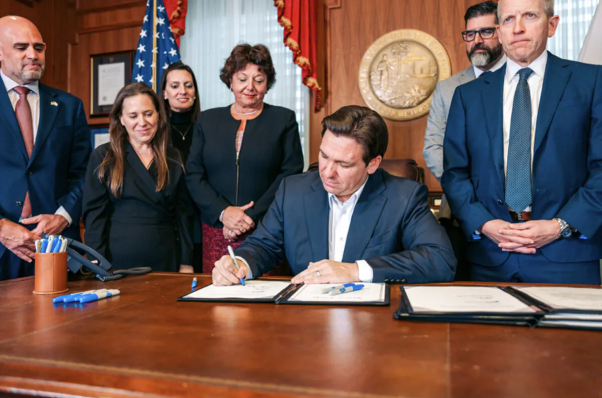 Florida Gov. Ron DeSantis signs bills to impose sanctions on Iran, provide security funding for Jewish institutions and historically black colleges and universities, increase Hurricane Idalia relief, and expand school vouchers, at his office in Tallahassee, Fla., on Nov. 13, 2023. (Courtesy of the Florida Governor's Office)