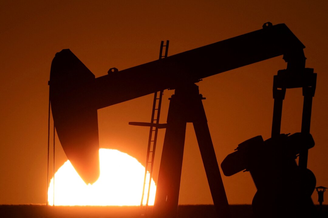 NextImg:IEA Raises Oil Demand Growth Forecasts, Flags Possible 2024 Surplus