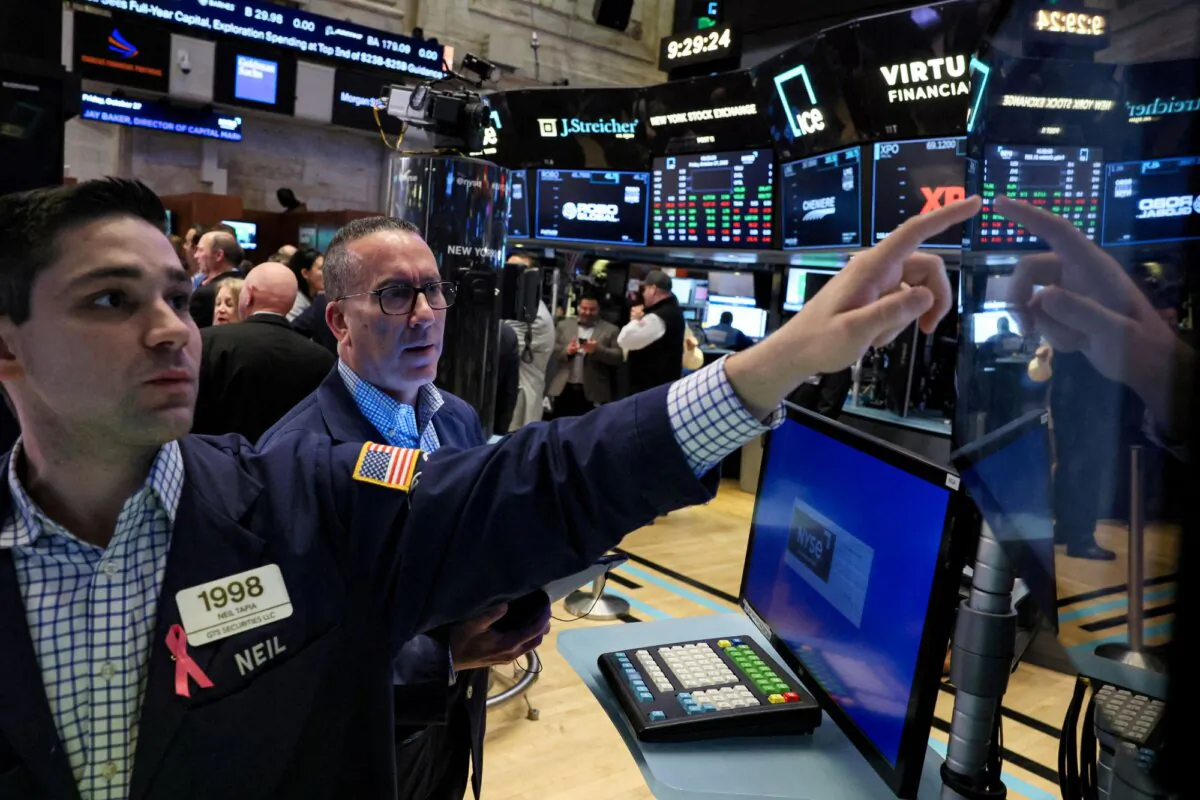 Traders work on the floor at the New York Stock Exchange (NYSE) in New York City on Oct. 27, 2023. (Brendan McDermid/Reuters)