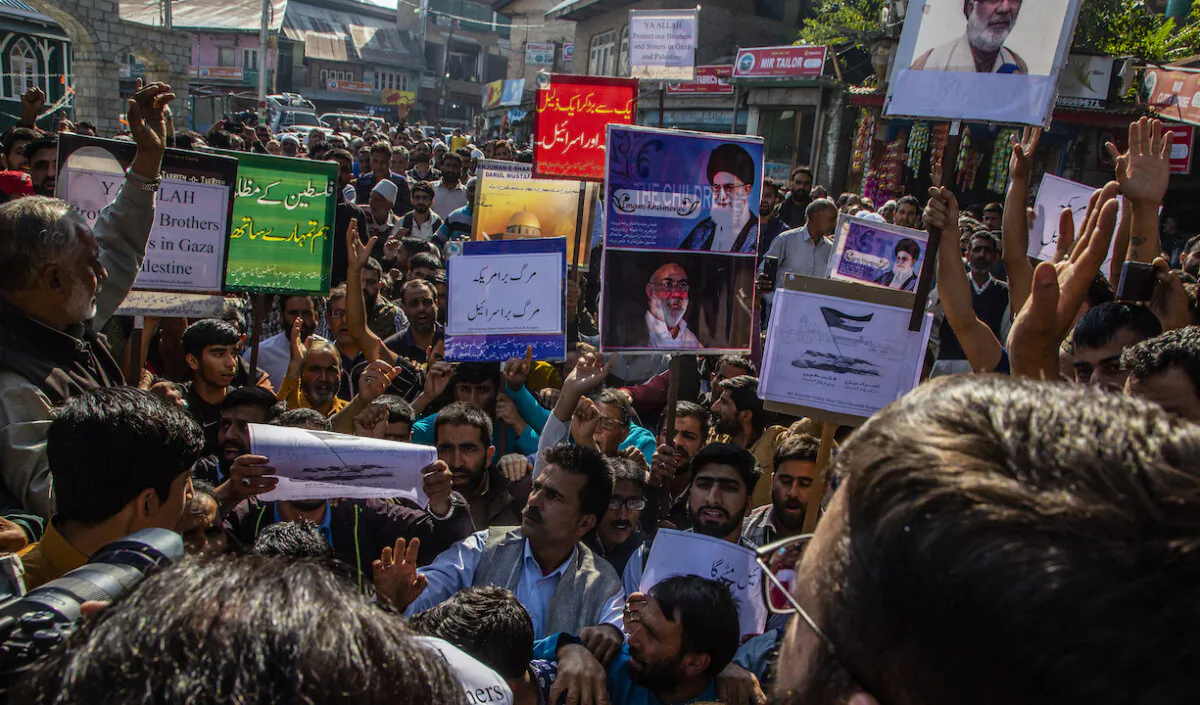 Kashmiri Muslims hold placards as they chant slogans against Israel and the United States during a protest against Israel's military operations against Gaza, in Kashmir, India, on Oct. 13, 2023. (Yawar Nazir/Getty Images)