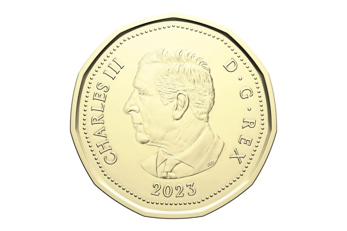 A likeness of King Charles is shown on a loonie in a handout photo. (The Canadian Press/HO-Royal Canadian Mint)