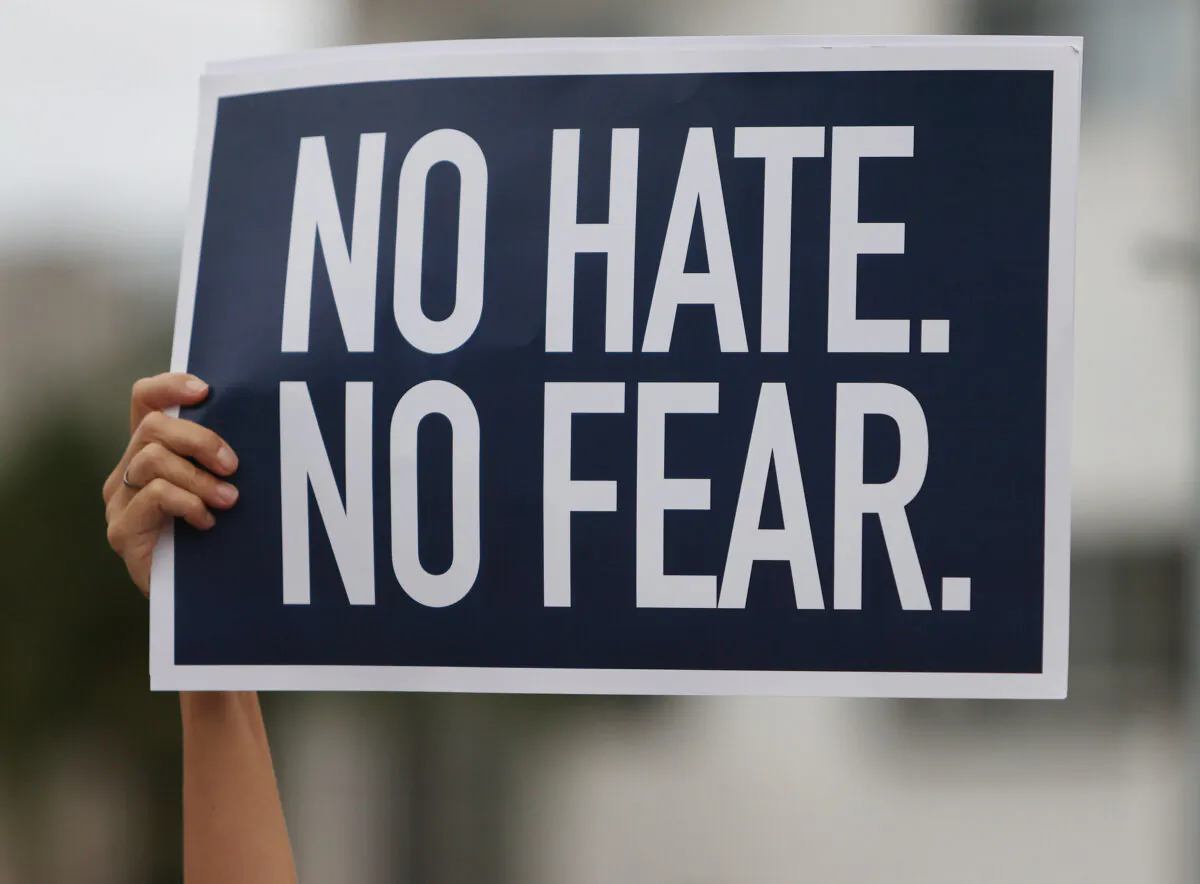 A sign is held up during an interfaith Rally Against Anti-Semitism, hosted by Greater Miami Jewish Federation at the Holocaust Memorial Miami Beach in Miami Beach, Fla., on June 3, 2021. (Joe Raedle/Getty Images)