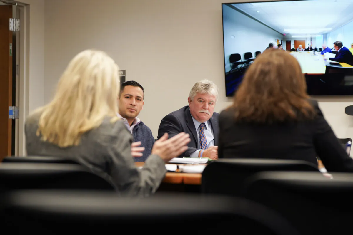 Orange County legislators Kevin Hines (2nd R) and Kevindaryán Luján (2nd L) hear from the county's general services commissioner, Samantha Sweikata, during a special investigative committee meeting in Goshen, N.Y., on Nov. 14, 2023. (Cara Ding/The Epoch Times)