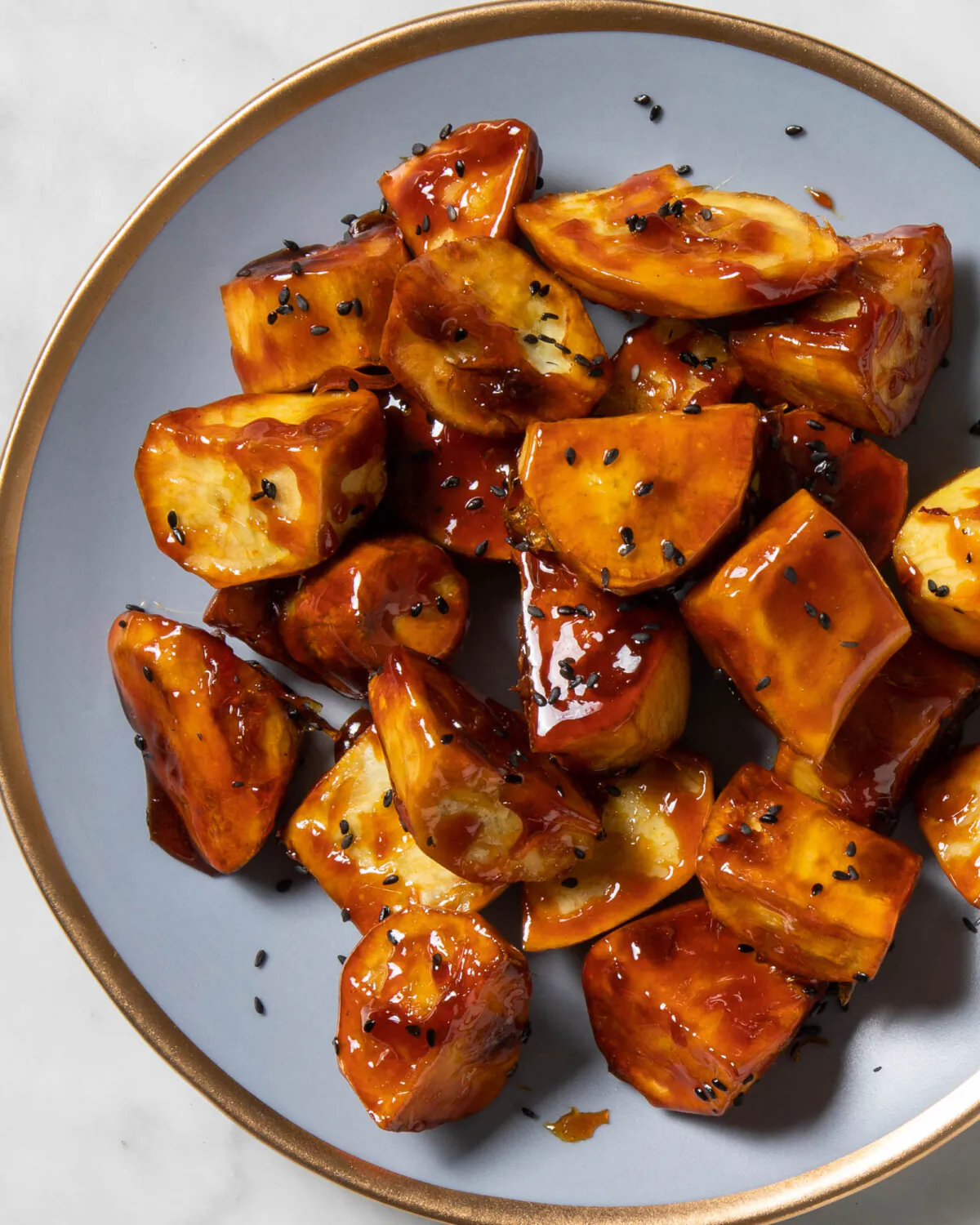 Candy coating meets fluffy sweet potato in this iconic Korean dessert. (Vicky Wasik/TNS)