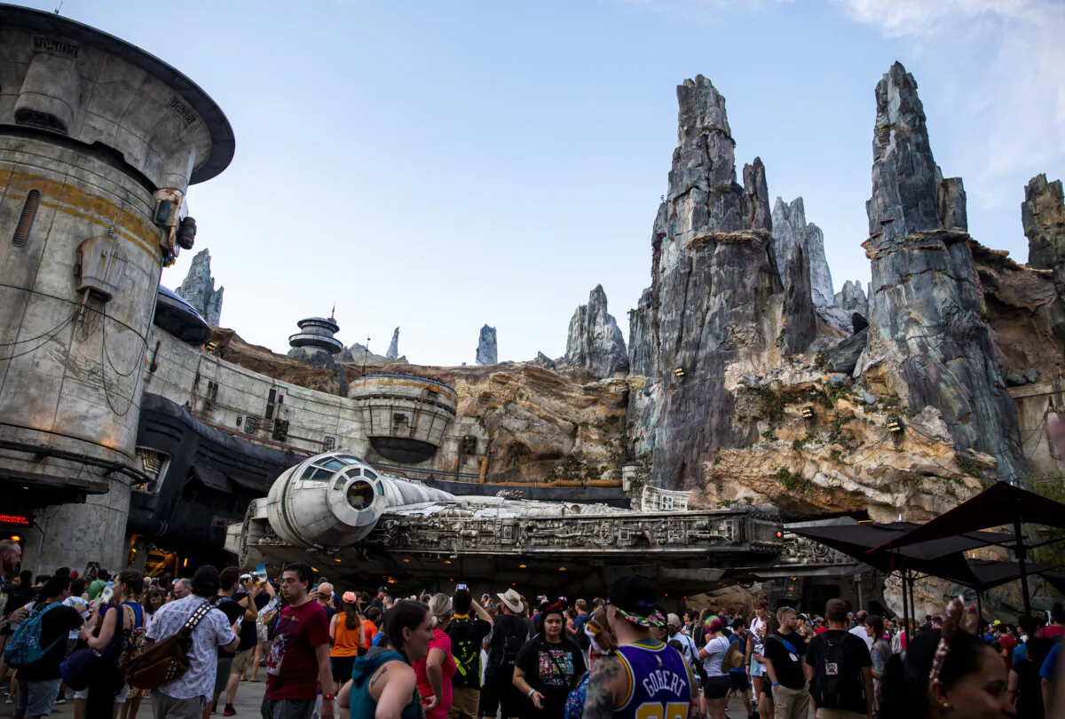 Star Wars fans line up around the Millennium Falcon during the opening of Star Wars: Galaxy's Edge at Disney's Hollywood Studios on Thursday, Aug. 29, 2019.(Patrick Connolly/Orlando Sentinel/TNS)